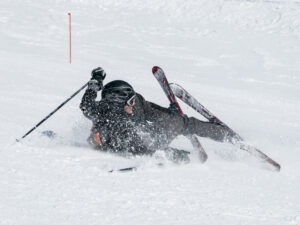 A skier hurt on a mountain slope and in need of the services of an experienced ski injury accident lawyer serving albuquerque