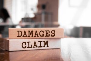 Wood blocks that say damages claim