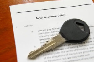 Auto insurance policy and key